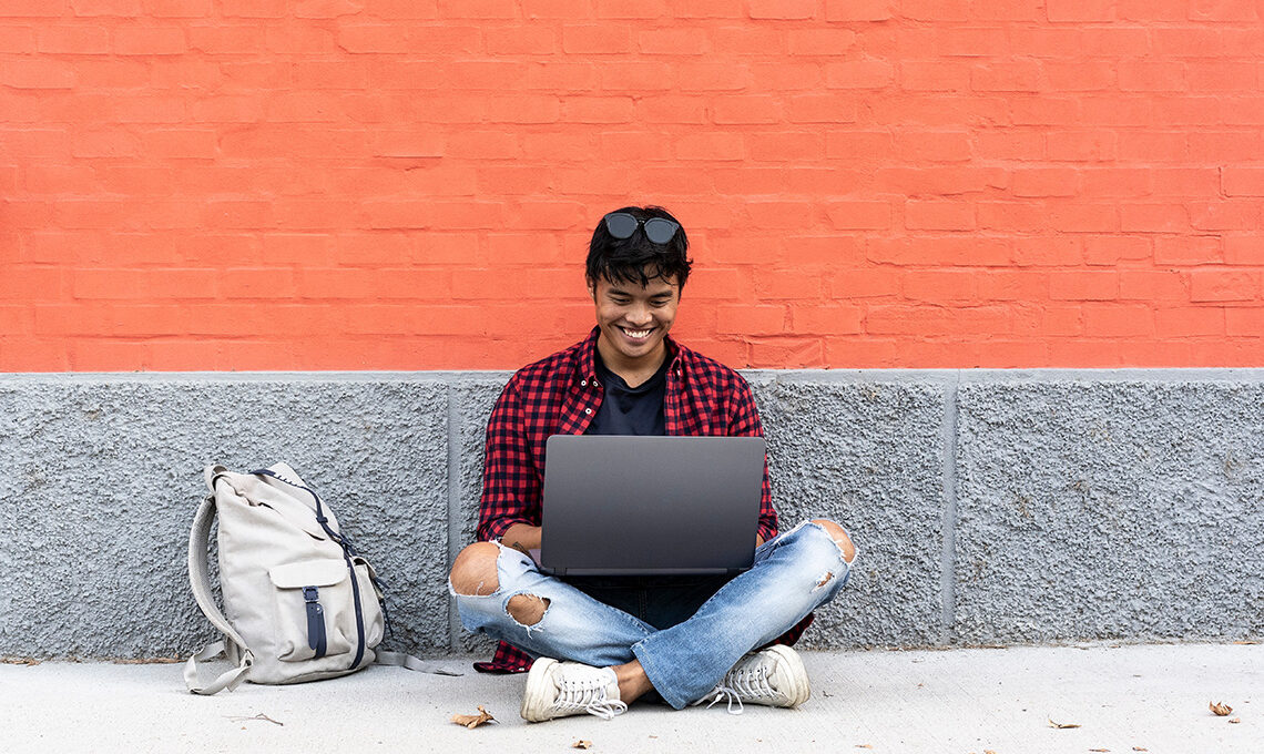 Student working on computer with access to eduroam mobile roaming services